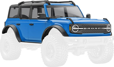 Body, Ford Bronco, complete, blue (includes grille, side mirrors, door handles, fender flares, windshield wipers, spare tire mount, & clipless mounting) (requires #9735 front & rear bumpers)